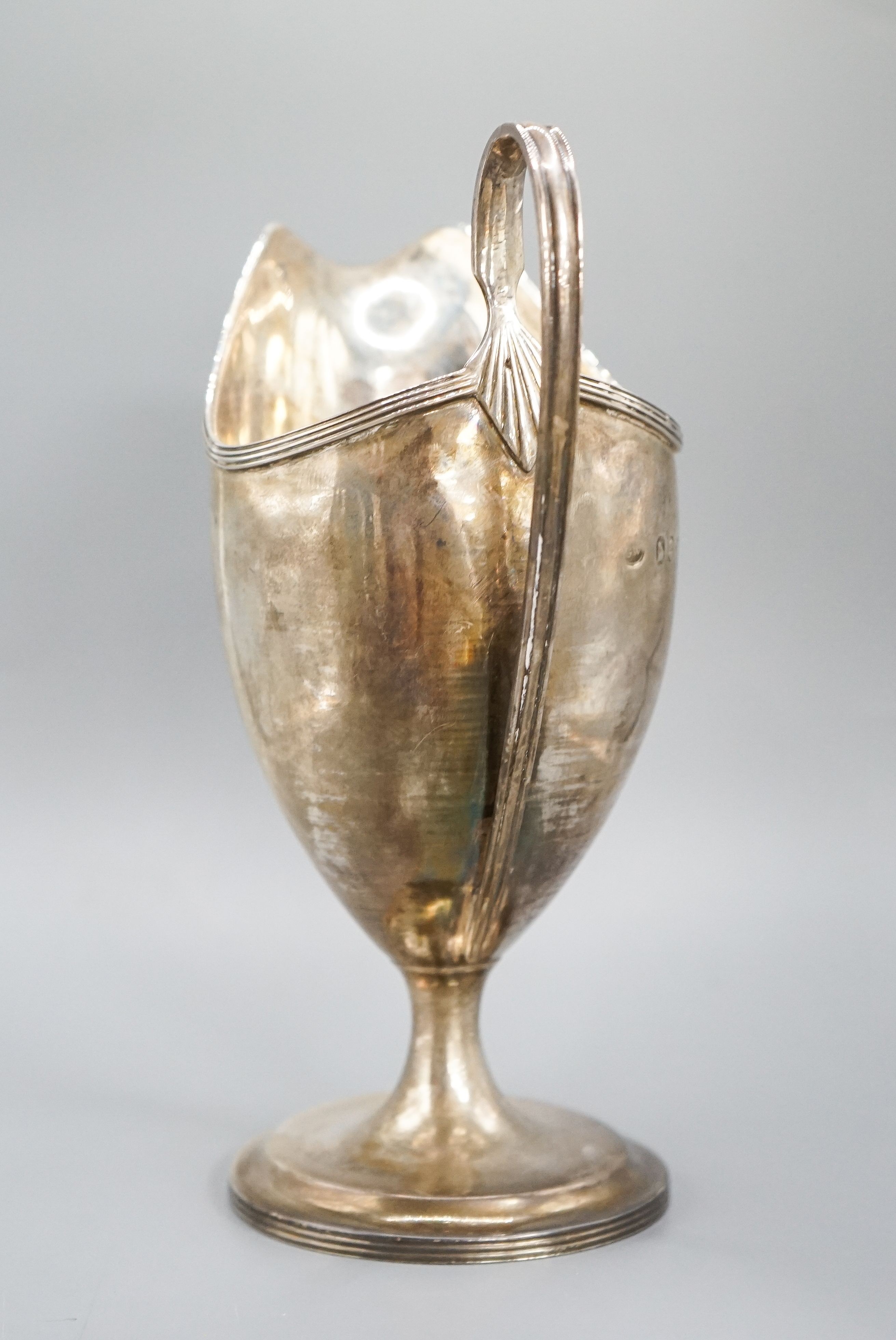 A George III Irish silver pedestal cream jug, George West, Dublin, 1794, 18cm, 7oz.